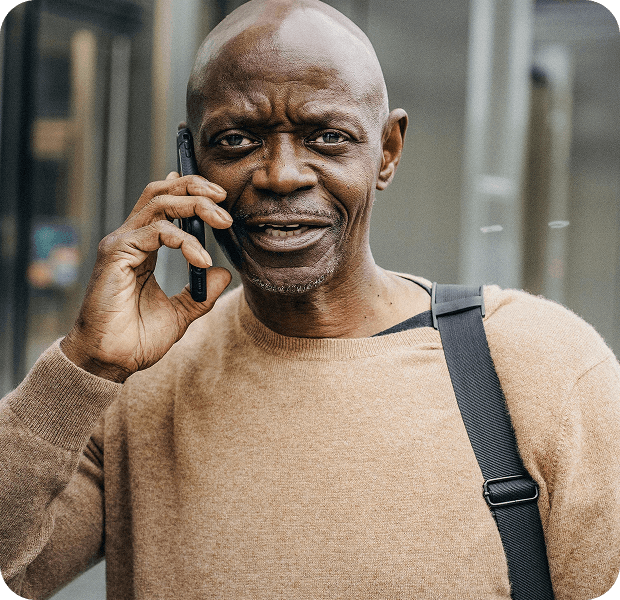 Professional on a phone call outdoors, ready to respond to nearby job requests